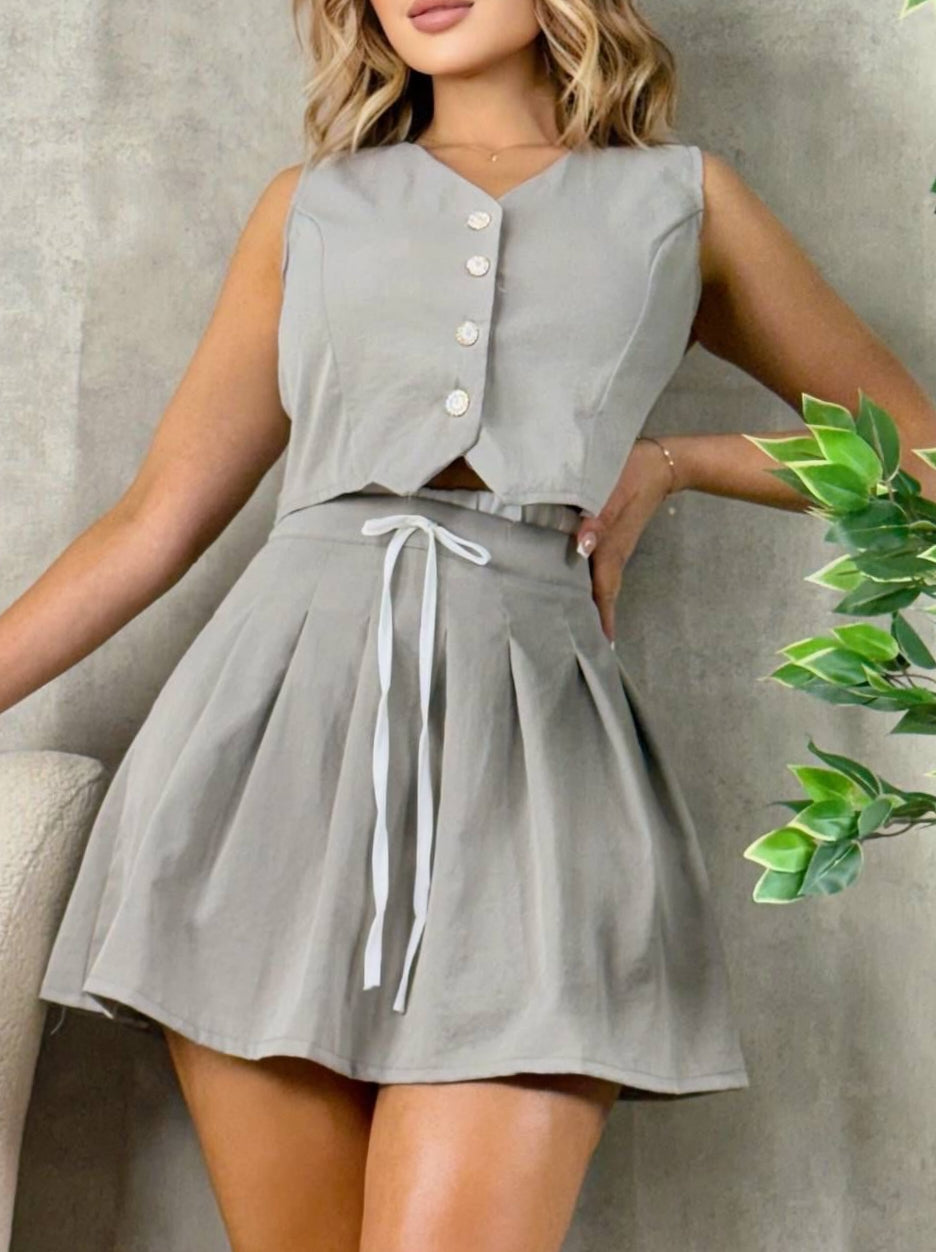 Conjunto chaleco falda corta
