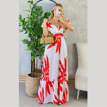 Vestido largo cruzado con estampado tropical y vuelo en el ruedo